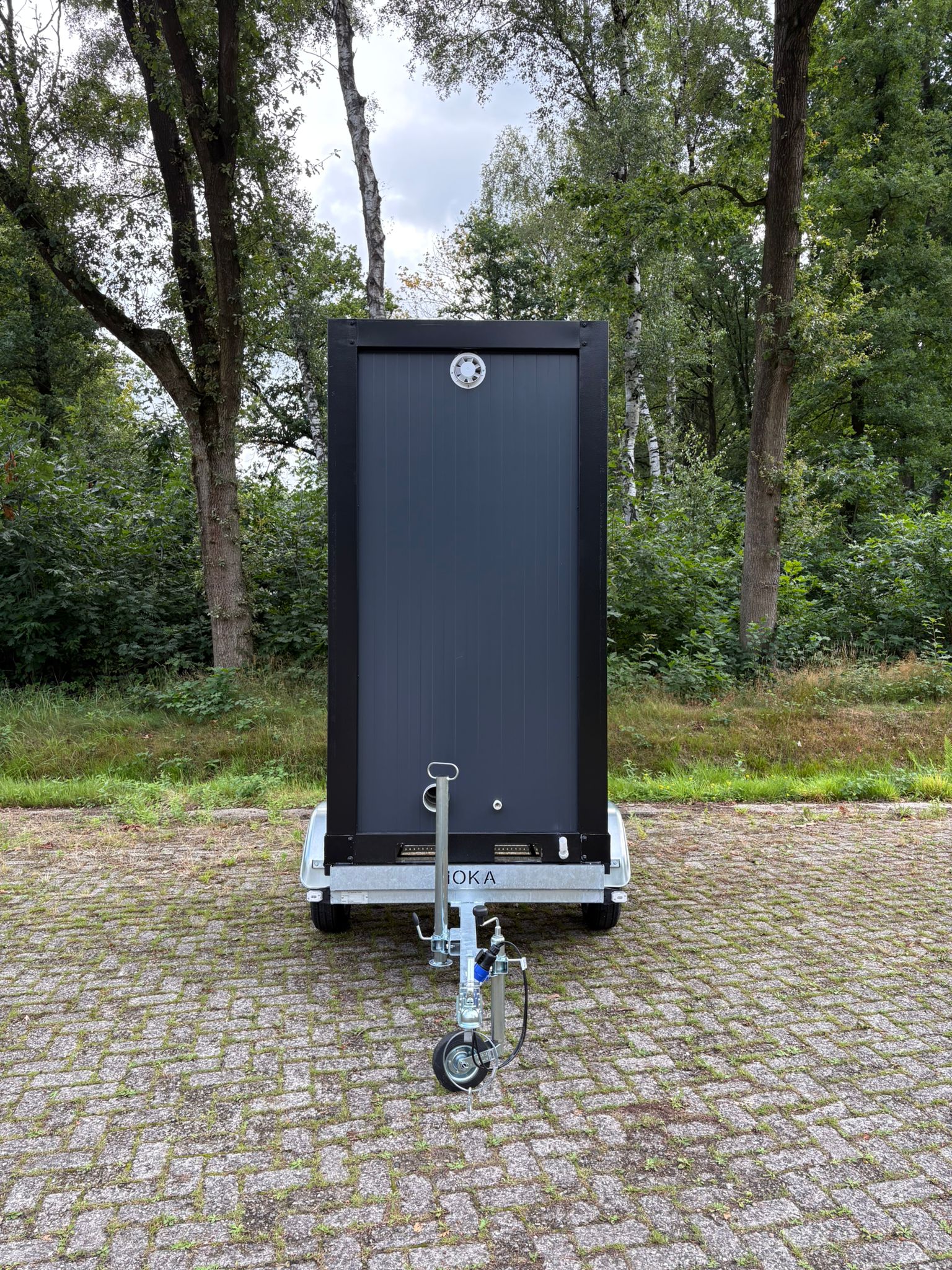 Single toiletwagen achterkant Dixi aanhanger